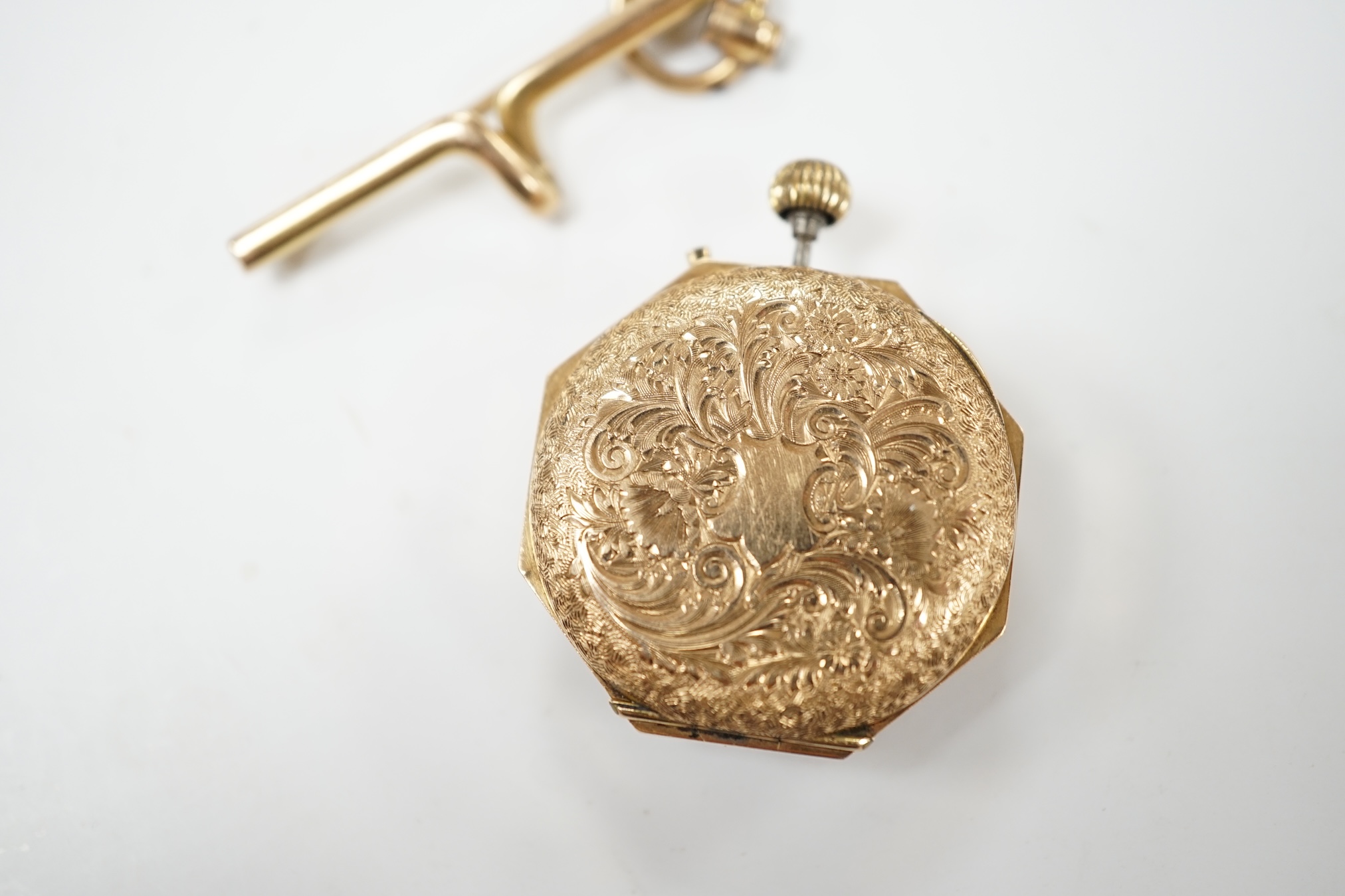 A lady's continental 14k fob watch, with Arabic dial, case diameter 29mm, gross weight 20.4 grams, together with a suspension brooch stamped '15', 3.3 grams. Condition - poor